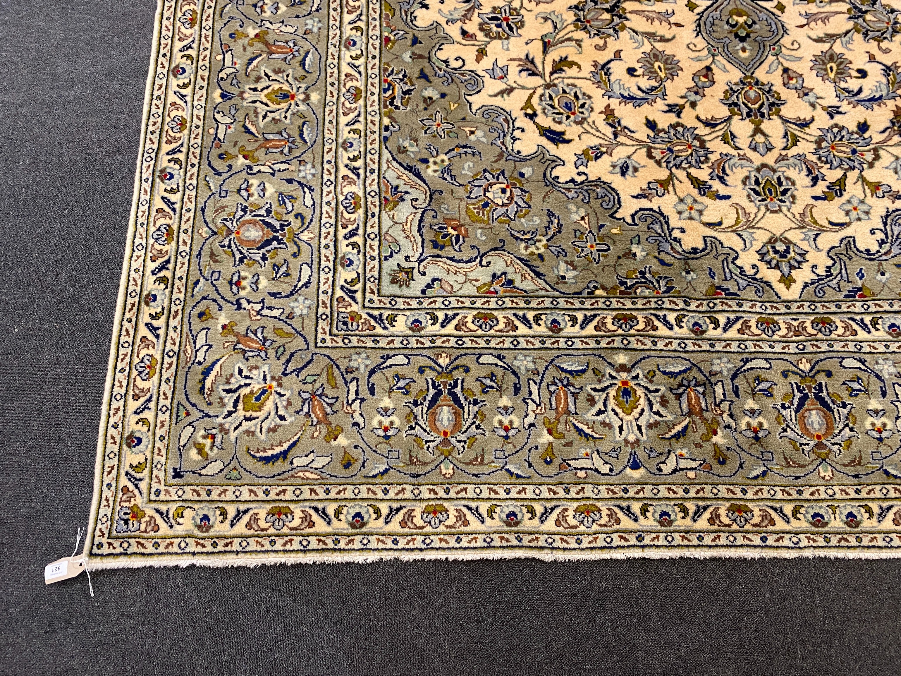 A Kashan ivory ground carpet, 355cm x 246cm